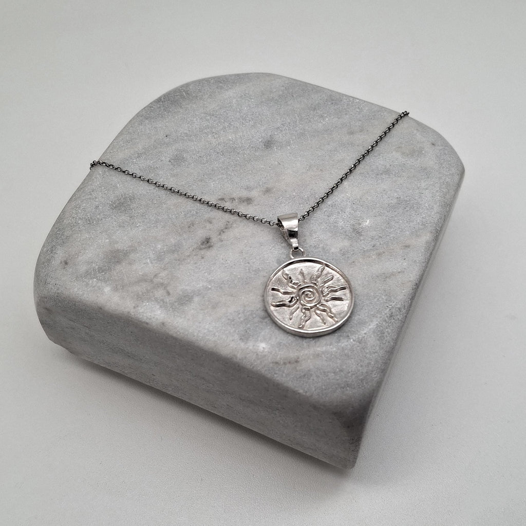 Sterling Silver Sun Necklace - Tribal Spiral Medallion Charm, close-up detail