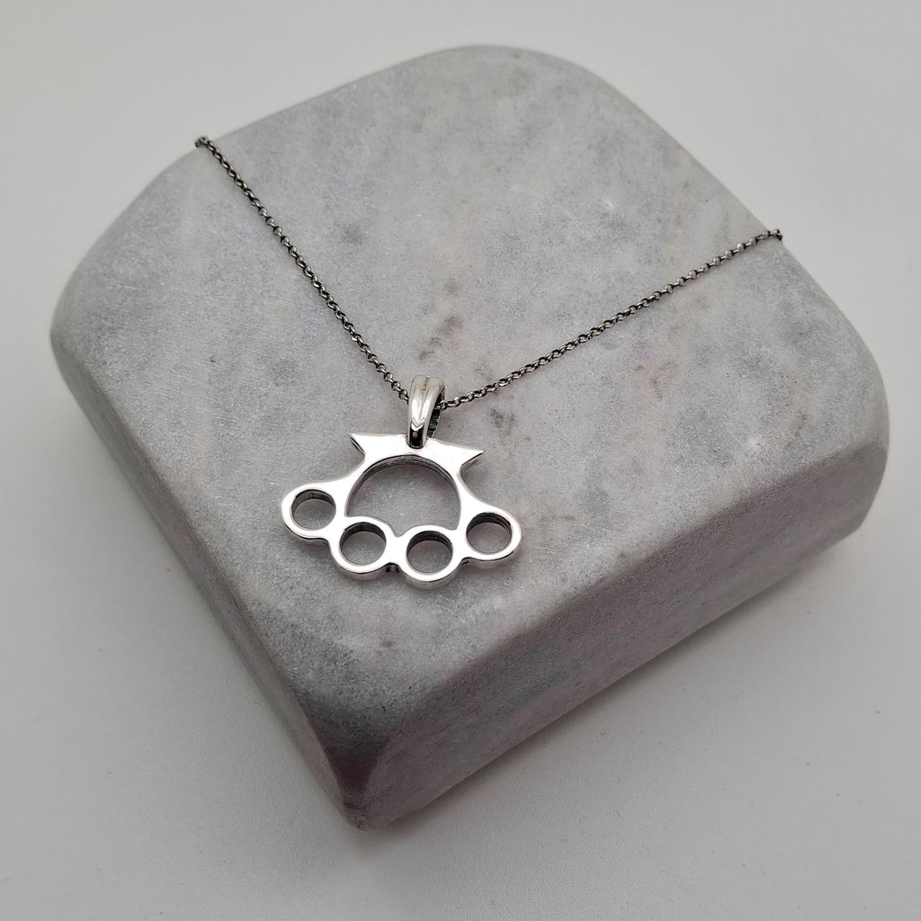 Knuckle Duster Necklace | Gold Plated Resilience Pendant, styled view