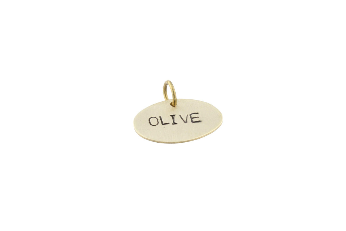 The Minimalist Oval Token | Artisan Pet ID & Custom Dog Tag, close-up detail