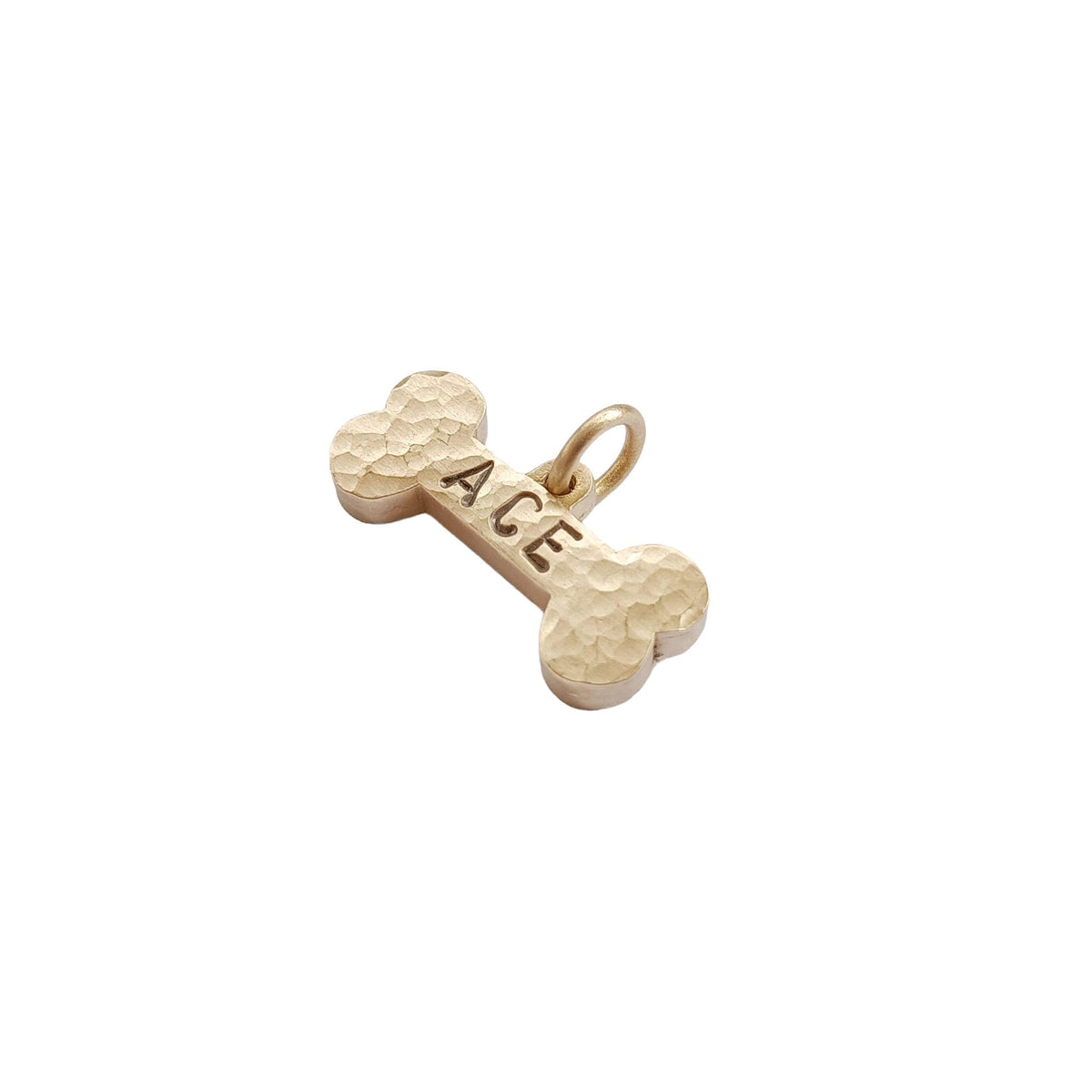 The Hand-Forged Bone Token | Ultra-Thick Hammered Brass Pet ID Tag, close-up detail