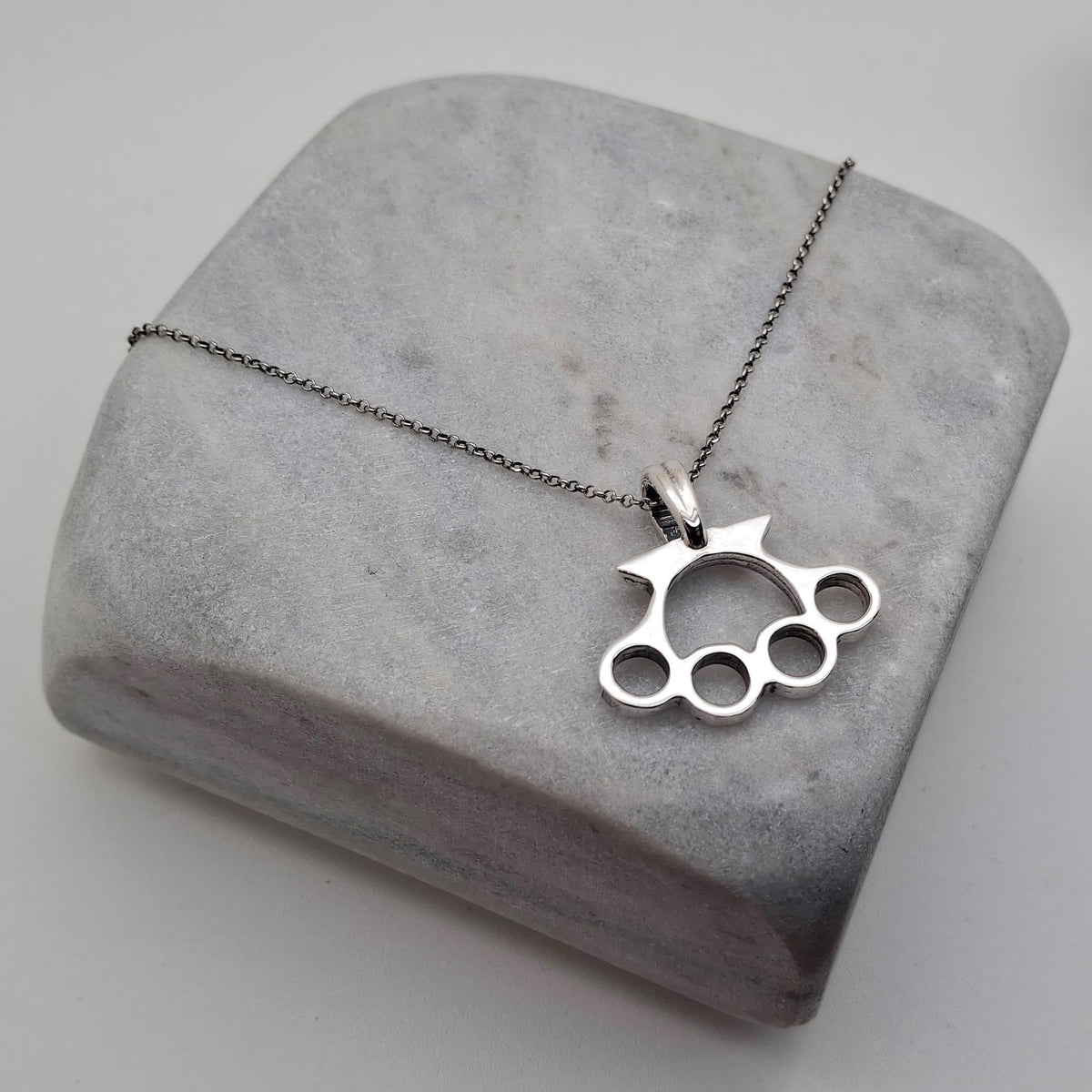 Knuckle Duster Necklace | Gold Plated Resilience Pendant, front view