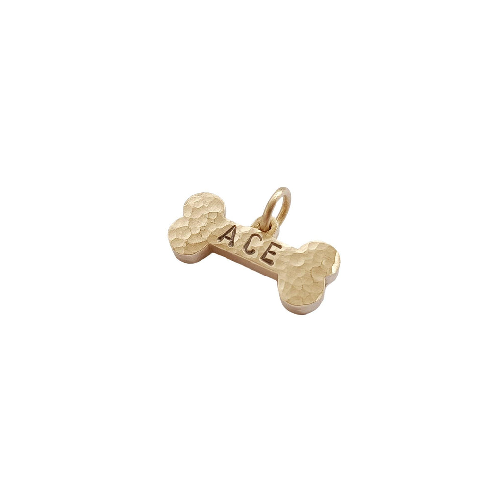 The Hand-Forged Bone Token | Ultra-Thick Hammered Brass Pet ID Tag, styled view