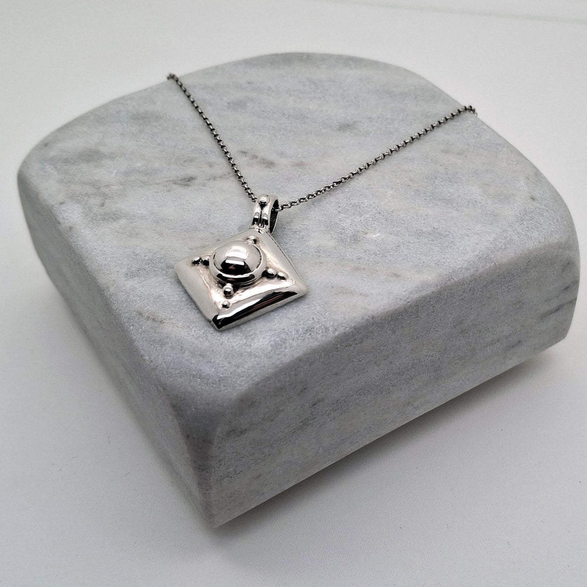 Armor Shield Necklace | Geometric Protection Pendant, front view