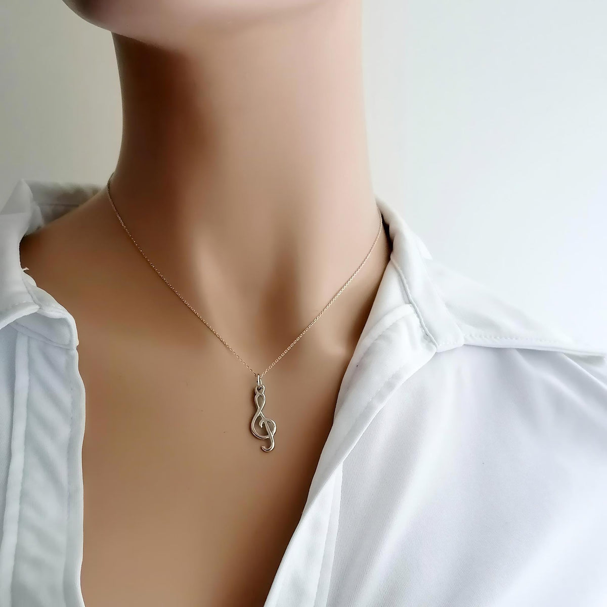 Treble Clef Necklace | Dainty Music Note Talisman, front view