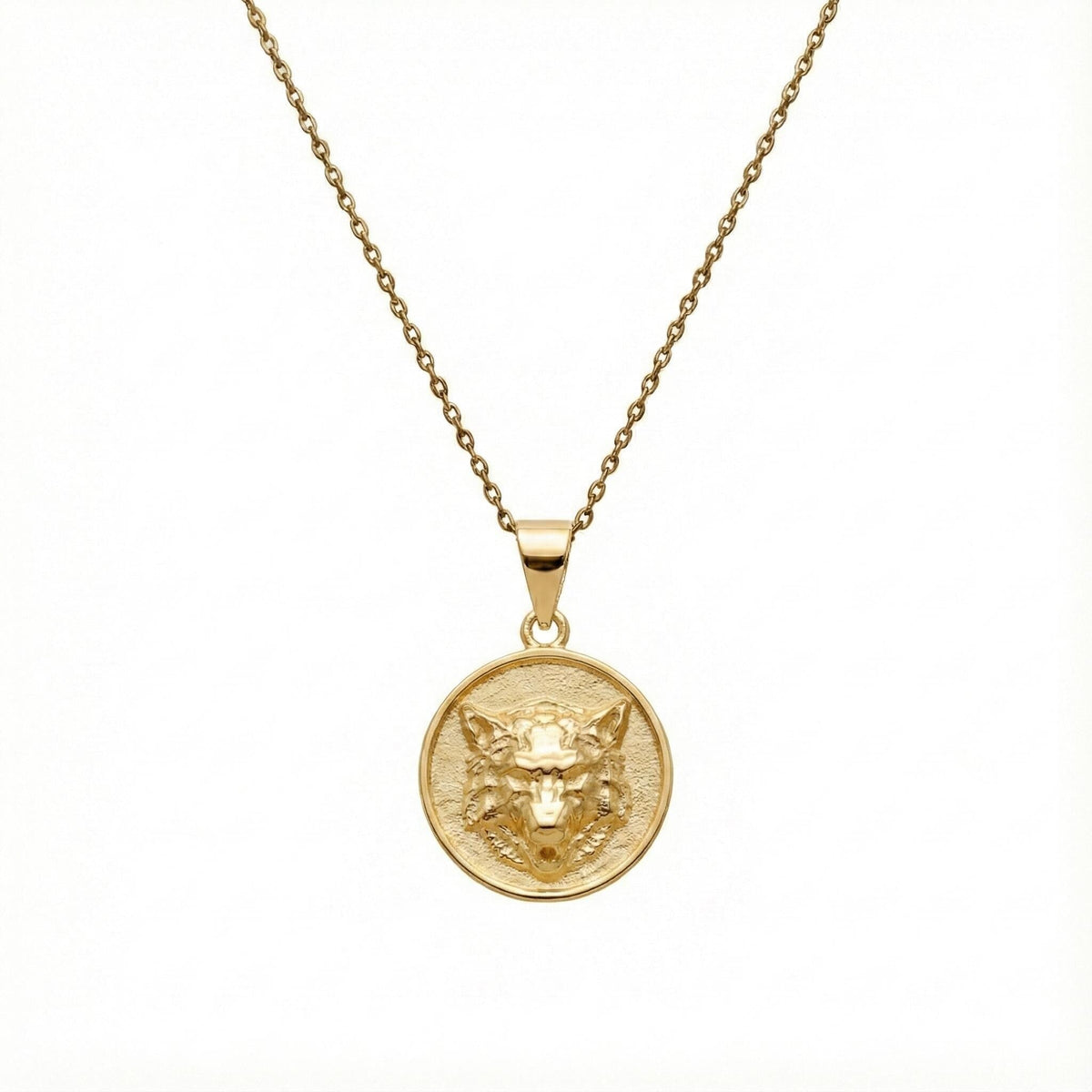 Howling Wolf Medallion sterling silver necklace flat lay on neutral surface