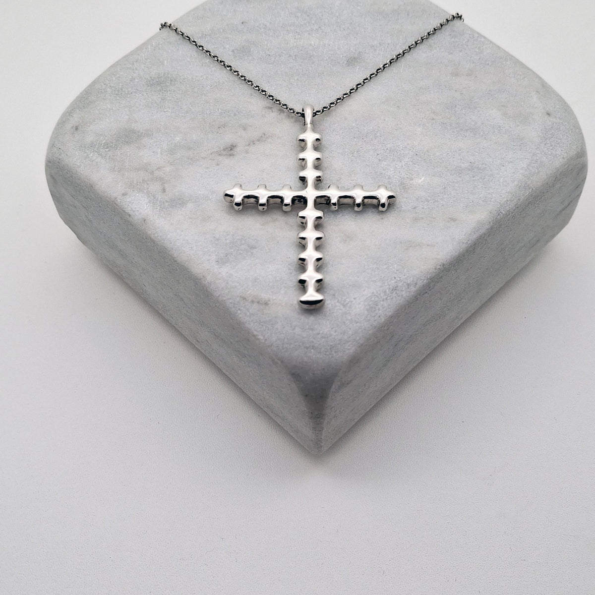 Bone Cross Necklace | Sterling Silver Gothic Spinal Pendant | Anatomical Memento Mori Jewelry, close-up detail