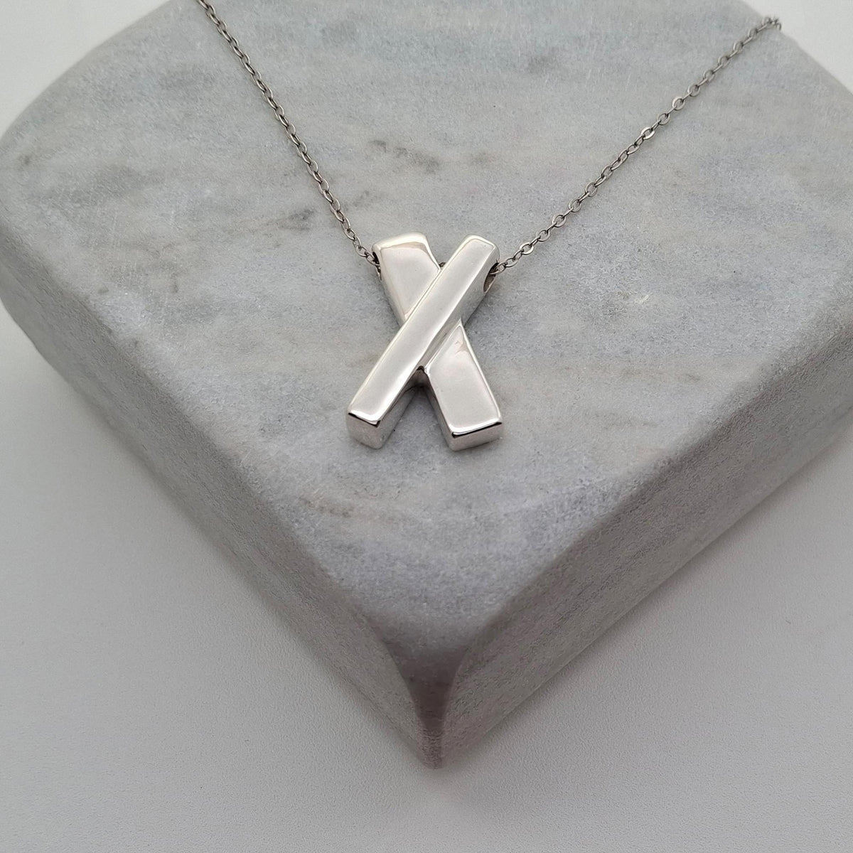 Minimalist Sterling Silver X Necklace | Dainty Kiss Cross Charm | Geometric Layering Pendant, front view