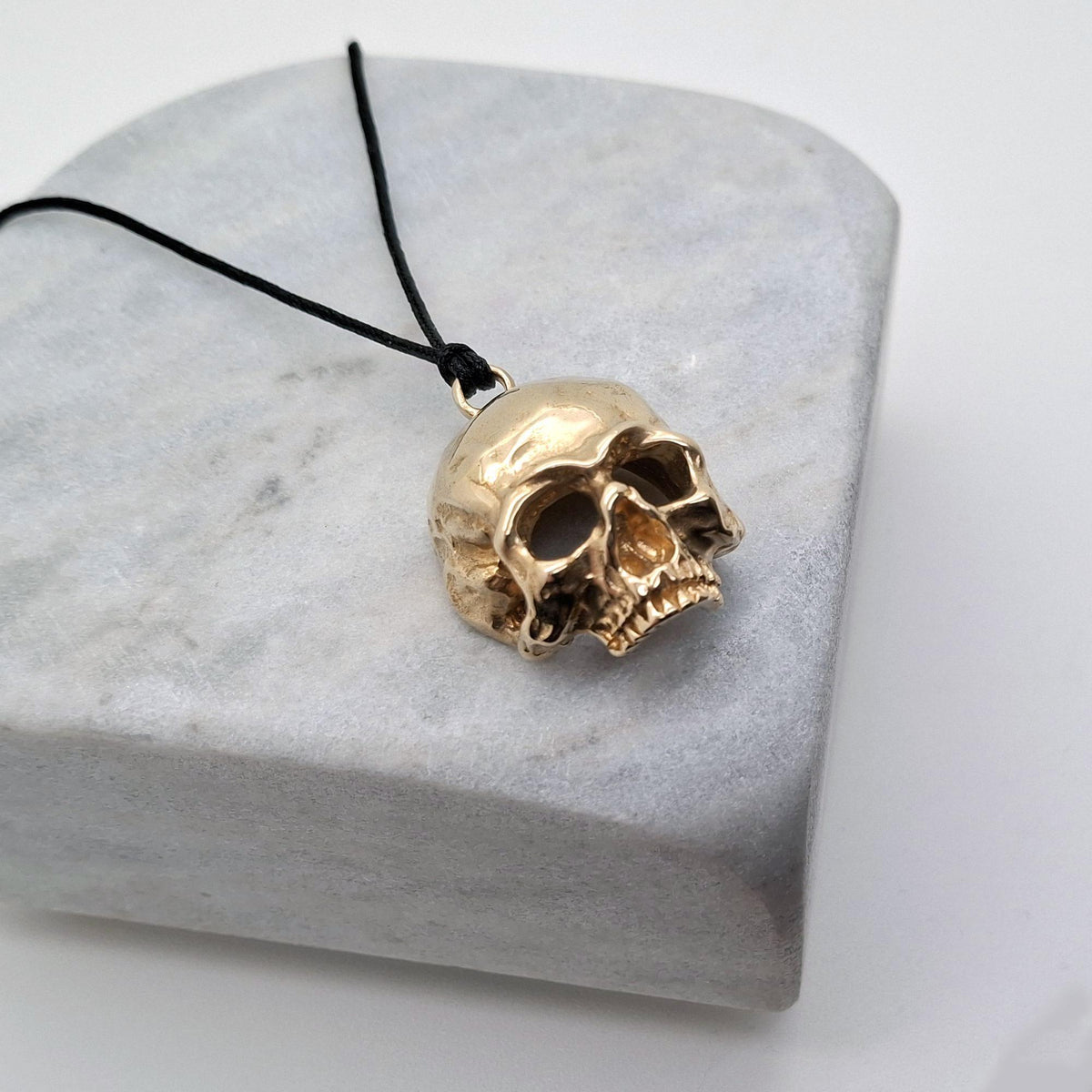 Brass Skull Necklace | 3D Gothic Memento Mori Pendant | Black Jade Cord Talisman, close-up detail