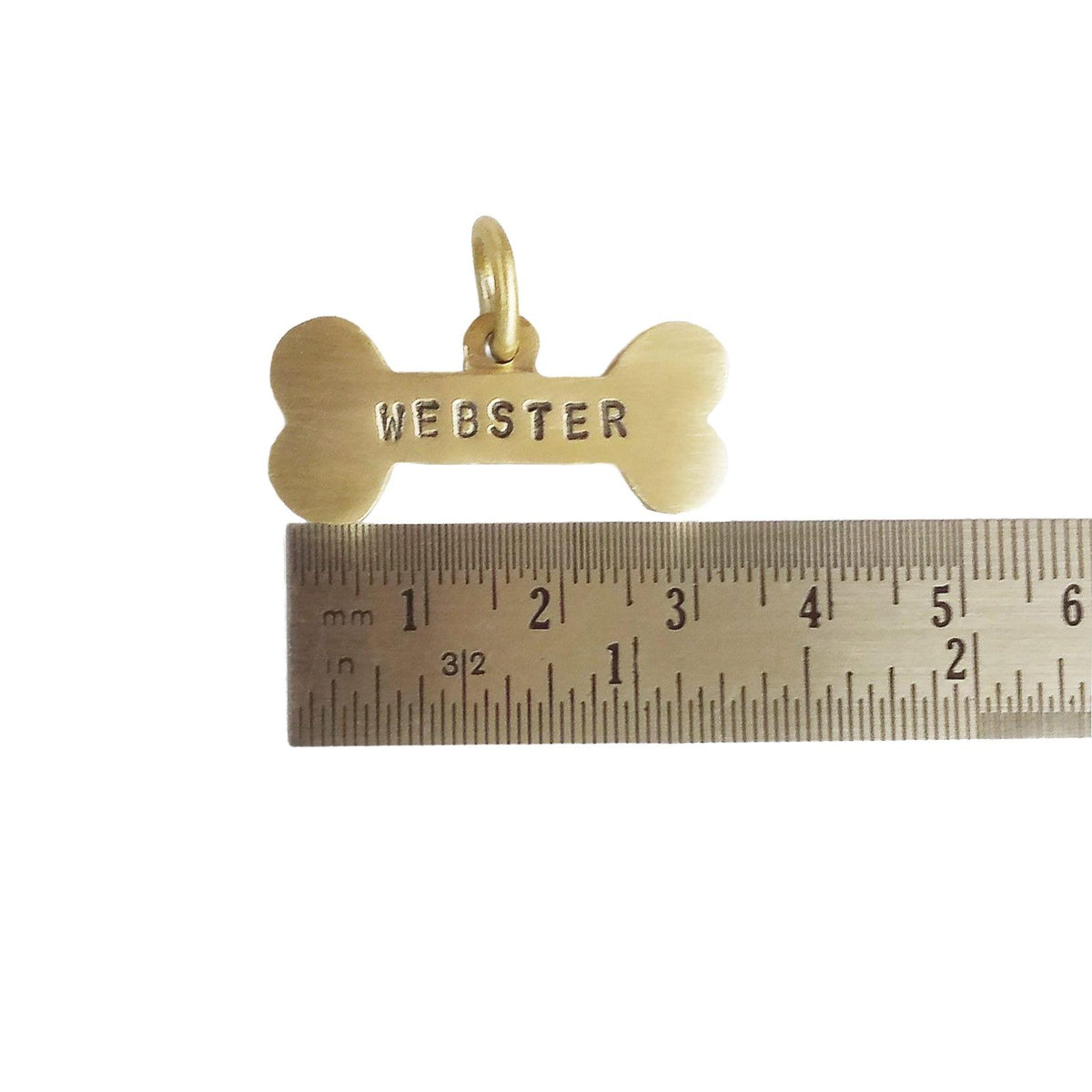 The Hand-Forged Bone Token | Ultra-Thick Hammered Brass Pet ID Tag, close-up detail