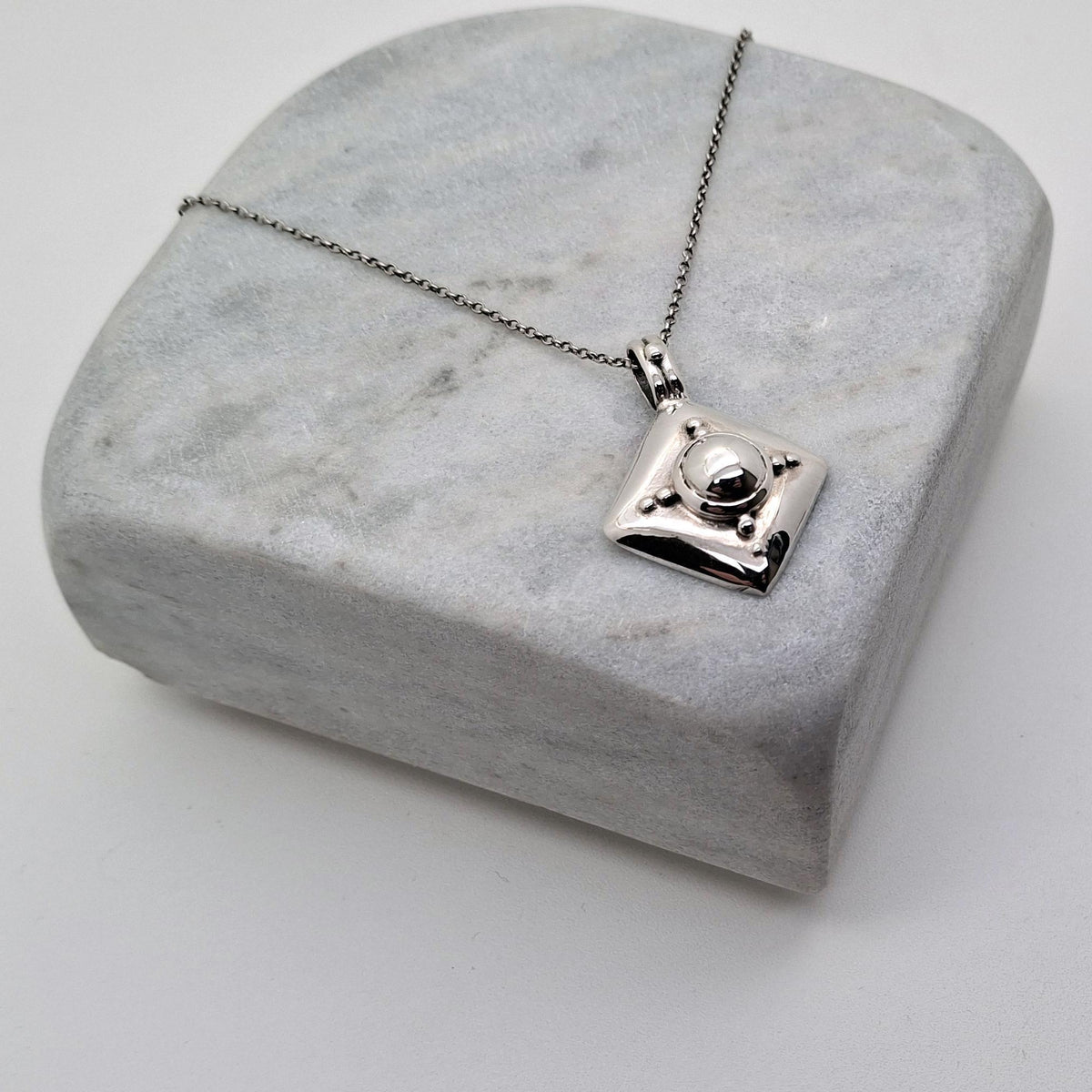 Armor Shield Necklace | Geometric Protection Pendant, close-up detail