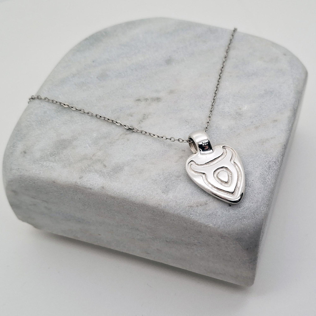 Taurus Moon Necklace | Double-Sided Zodiac Pendant, close-up detail