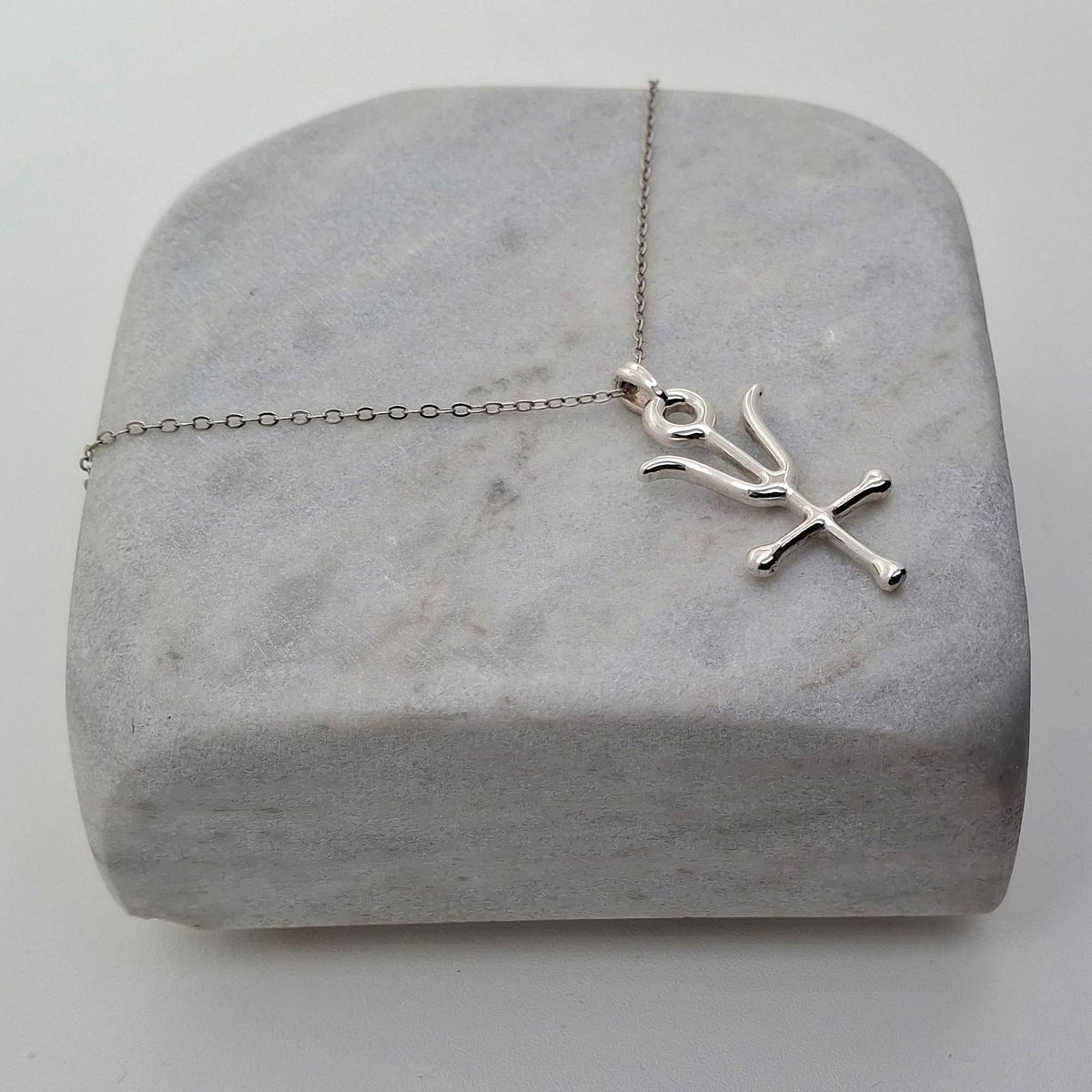 Antimony Alchemy Pendant | Wolf of Metals Talisman, close-up detail
