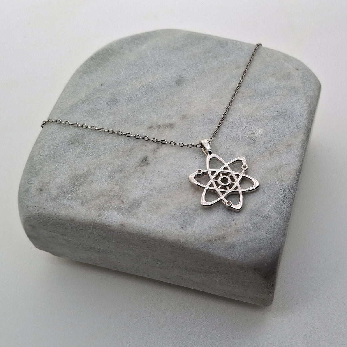 Atom Necklace | Sterling Silver Bohr Model Pendant | Science & Molecular Talisman, styled view