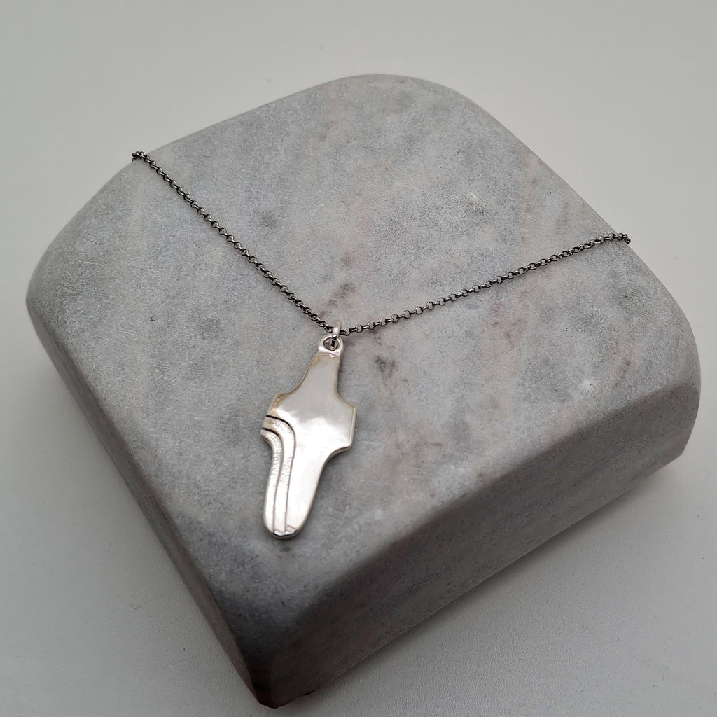 Abstract Cross Pendant, styled on a chain