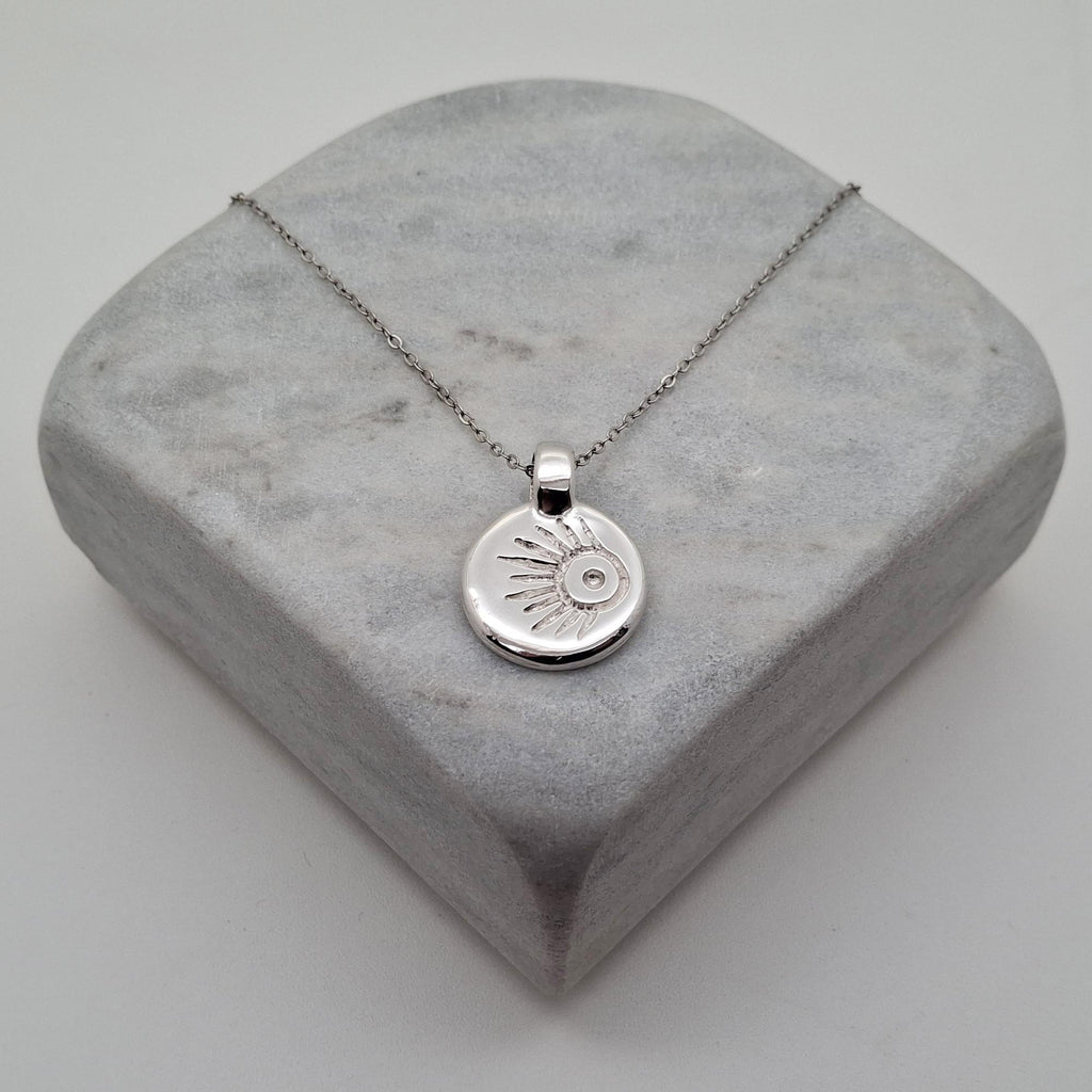 Meteor Wish Talisman Necklace | Gold Plated Celestial Coin Pendant | Shooting Star Sunburst Medallion, close-up detail
