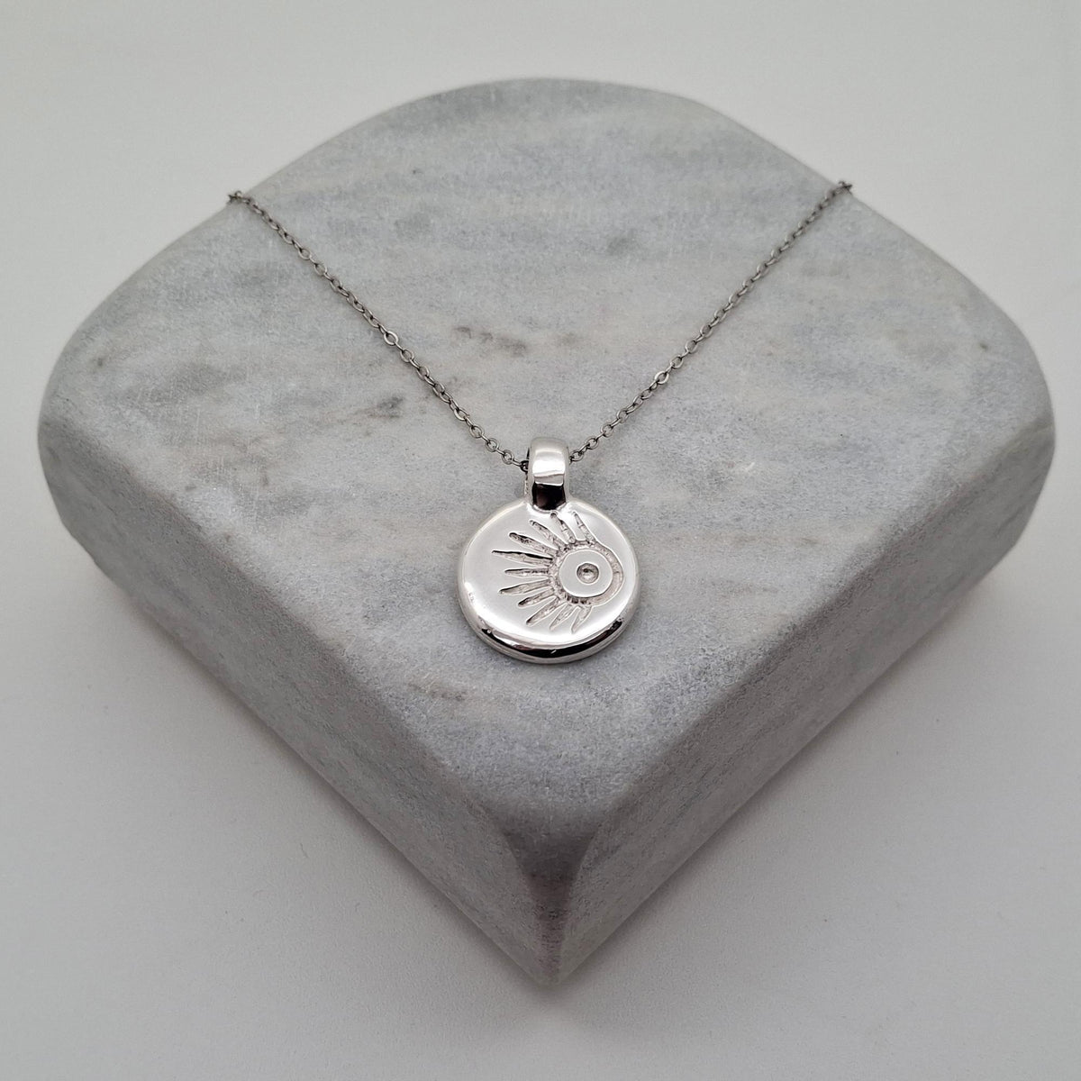 Meteor Wish Talisman Necklace | Gold Plated Celestial Coin Pendant | Shooting Star Sunburst Medallion, close-up detail