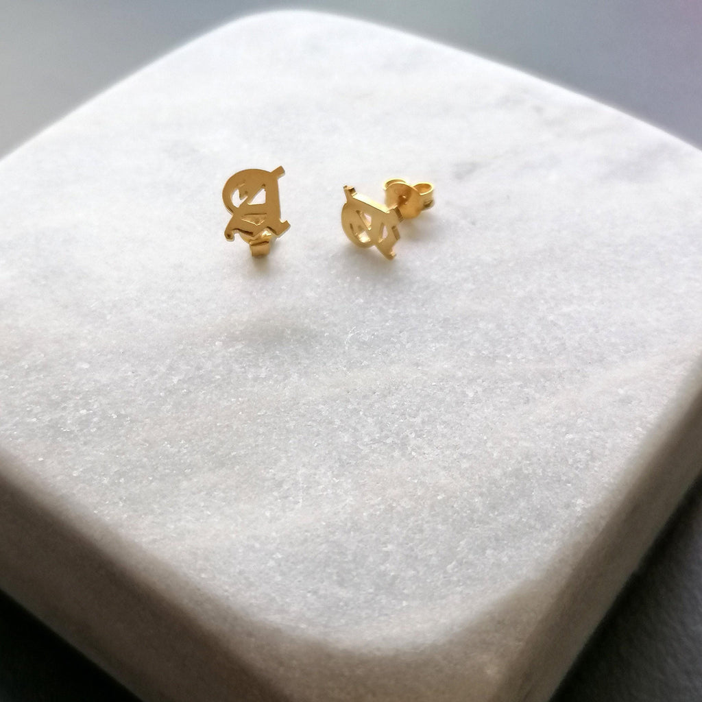 Initial Stud Earrings | Old English Lettering, close-up detail