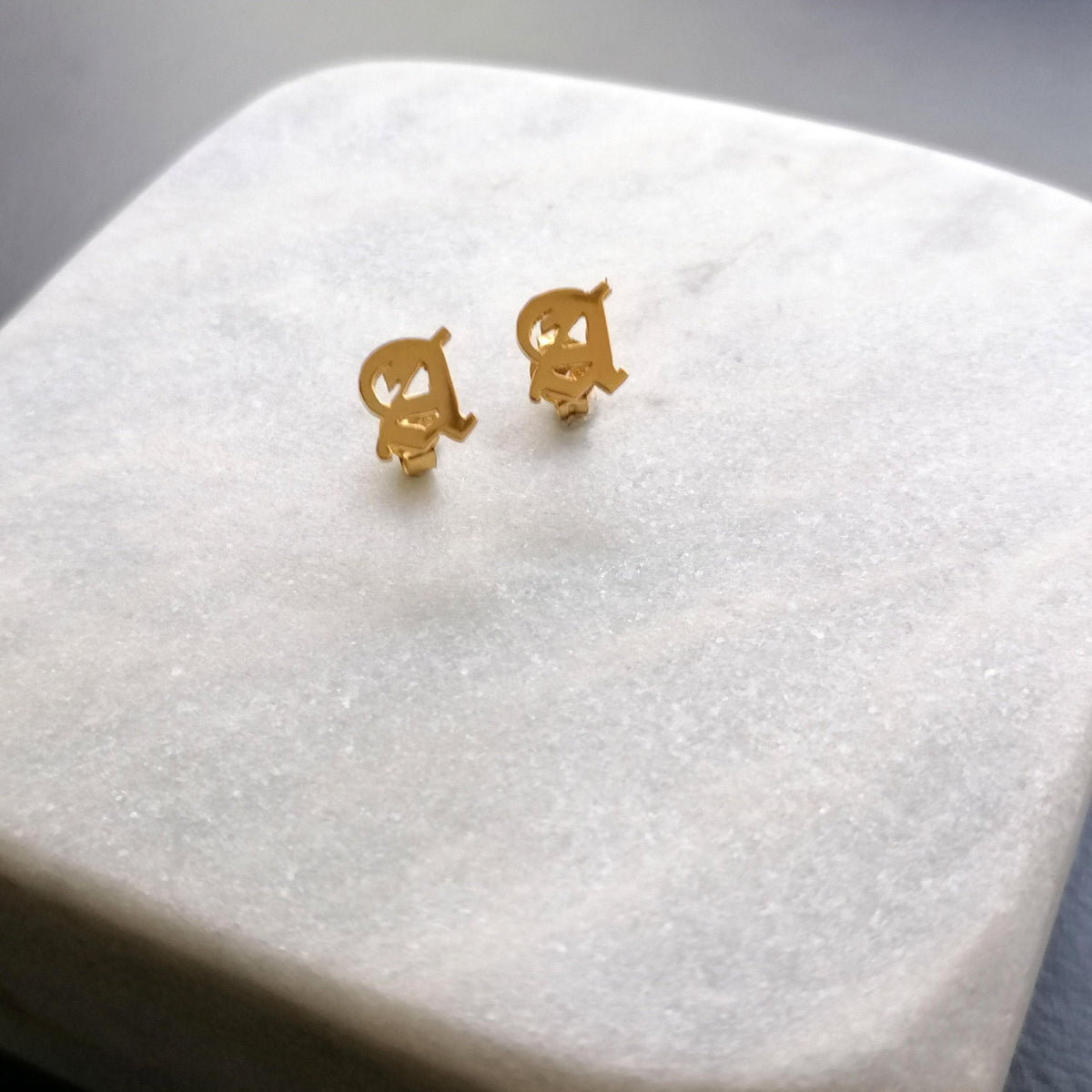 Initial Stud Earrings | Old English Lettering, front view