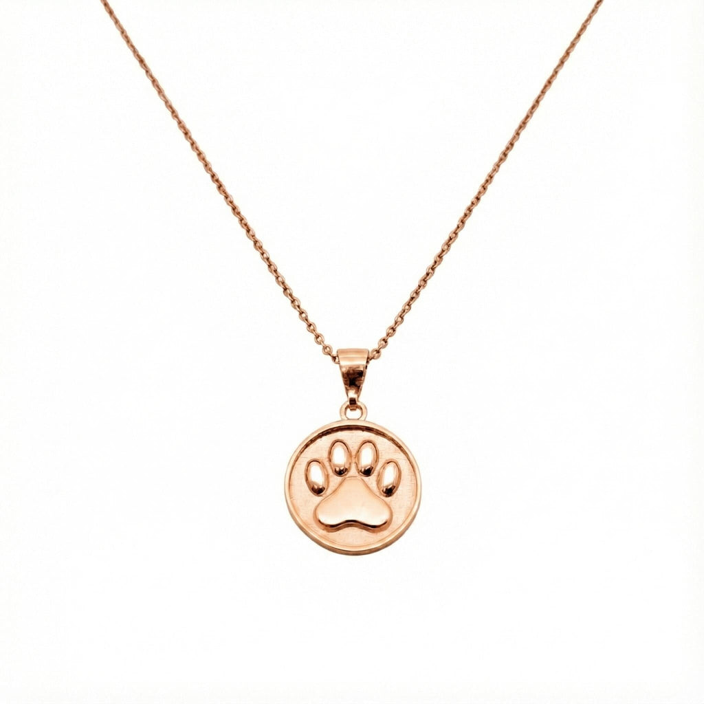 Paw Print Necklace flat lay, oxidized sterling silver