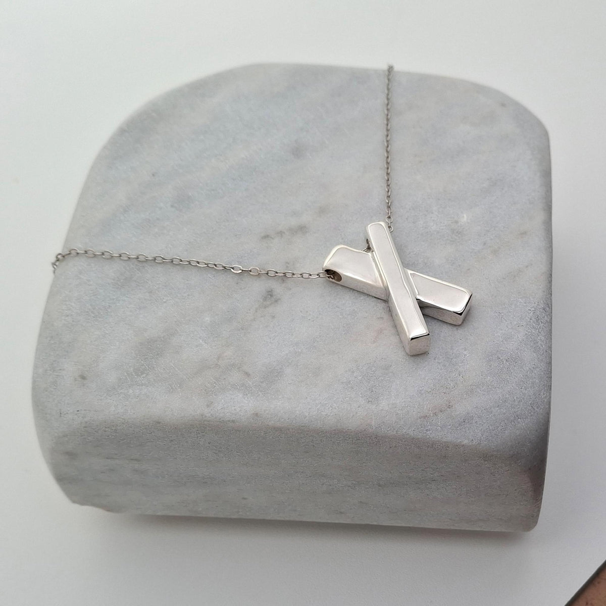 Minimalist Sterling Silver X Necklace | Dainty Kiss Cross Charm | Geometric Layering Pendant, alternate angle
