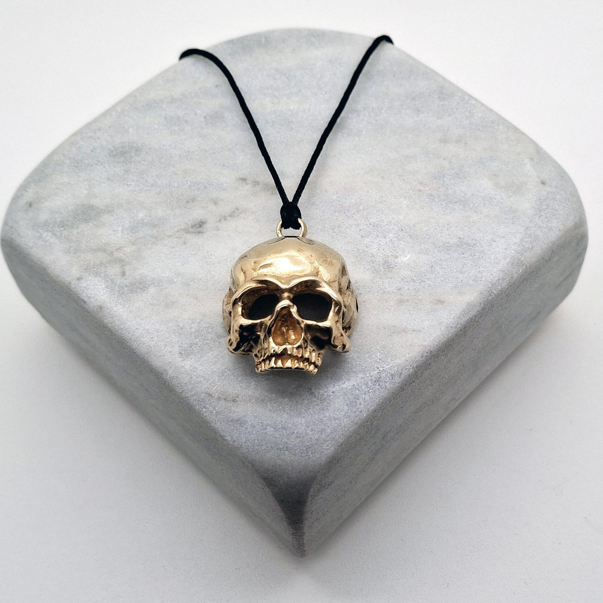 Brass Skull Necklace | 3D Gothic Memento Mori Pendant | Black Jade Cord Talisman, front view