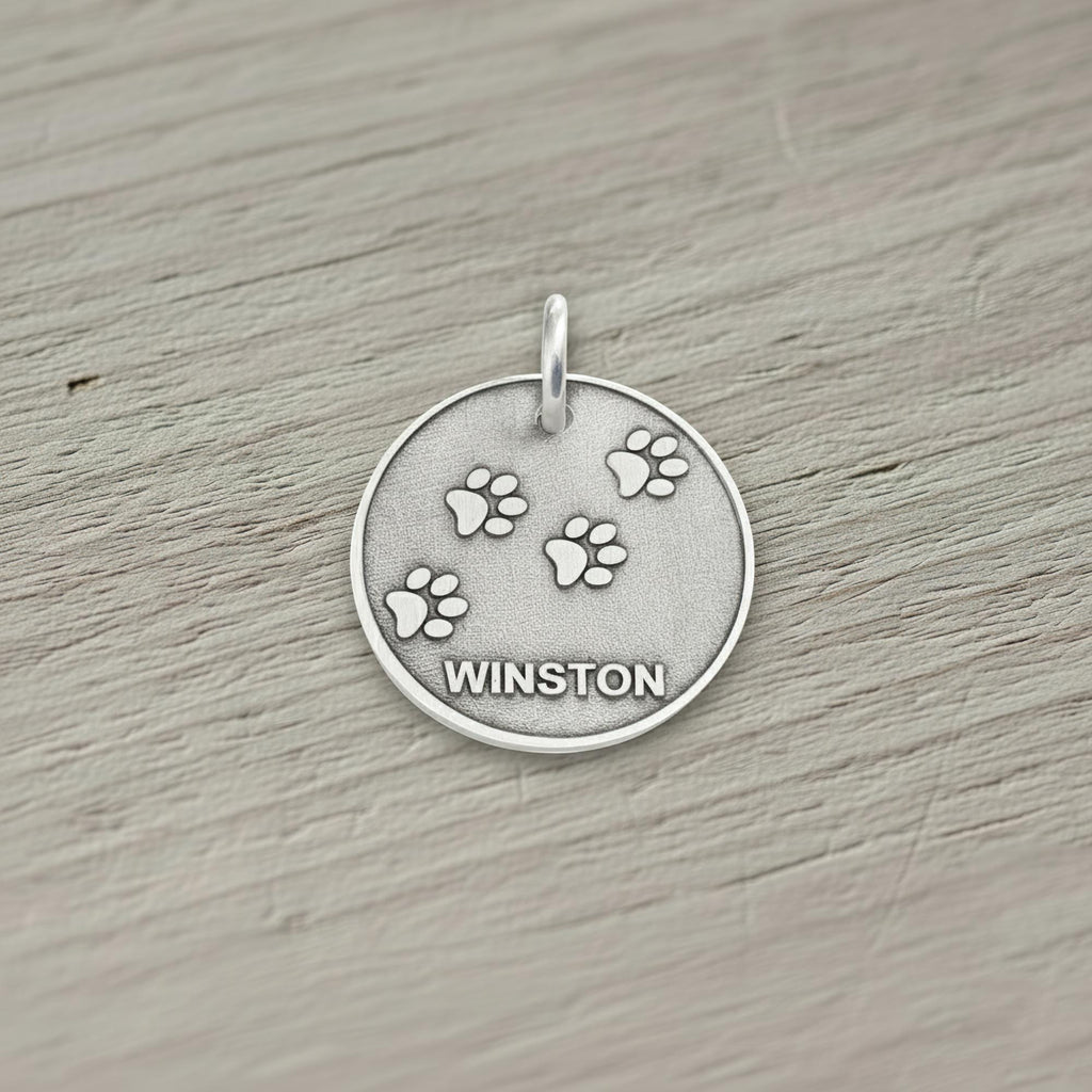 Paw Print Dog Tag | Custom Engraved Sterling Silver Pet ID | Heavy Duty Collar Charm, styled view