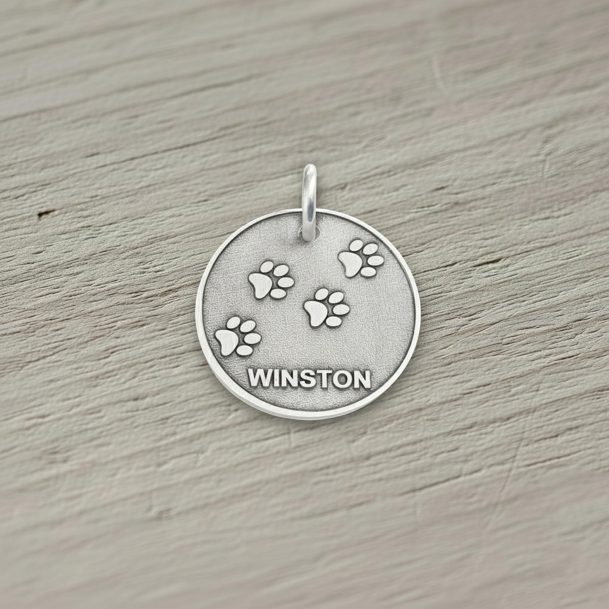 Paw Print Dog Tag | Custom Engraved Sterling Silver Pet ID | Heavy Duty Collar Charm, styled view