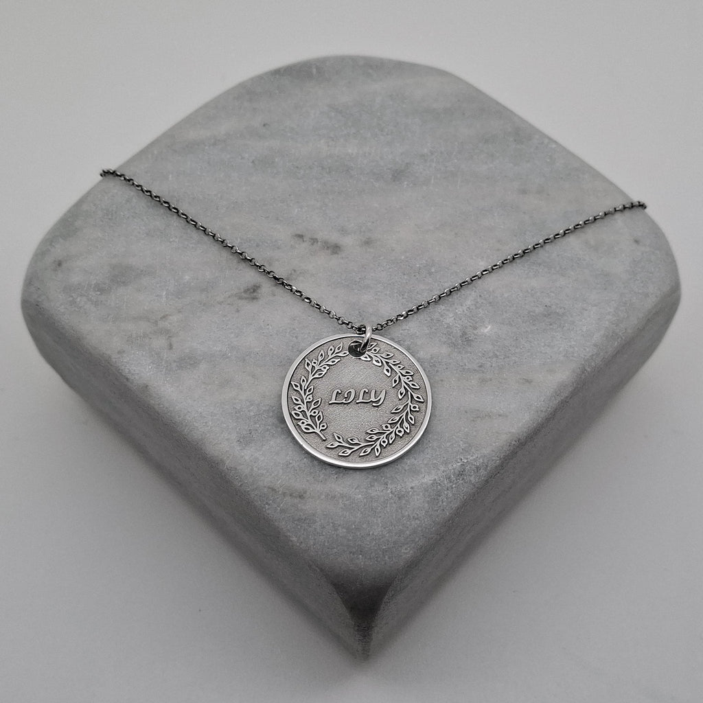 Custom Name Necklace Pendant | Hand-Stamped Sterling Silver Laurel Wreath Charm | Personal Victory Medallion, alternate angle