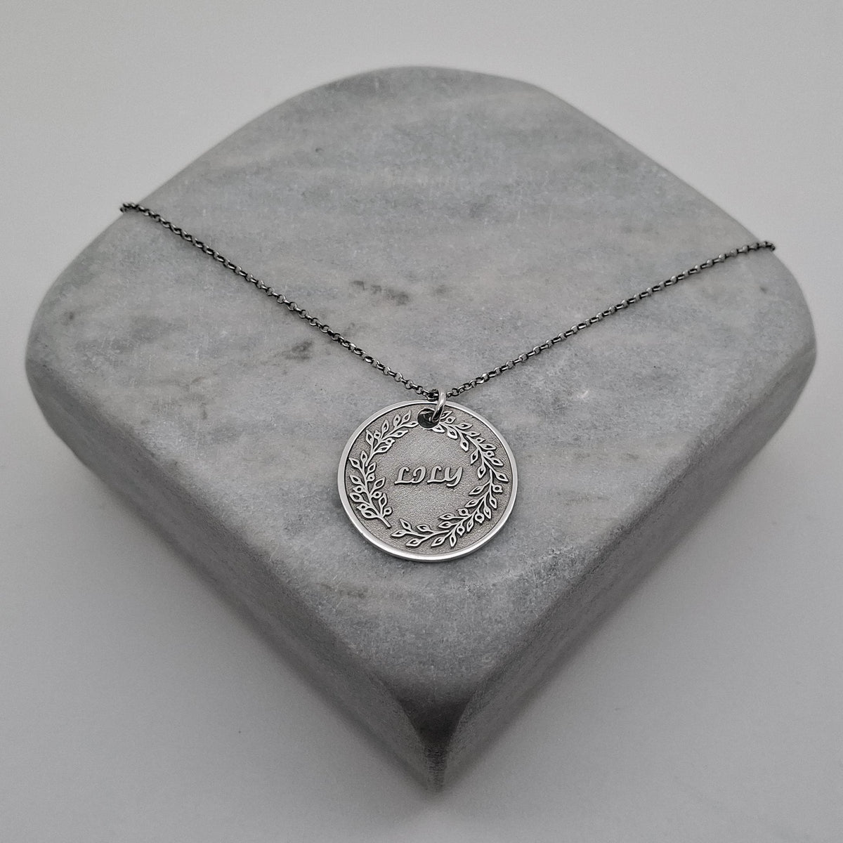 Custom Name Necklace Pendant | Hand-Stamped Sterling Silver Laurel Wreath Charm | Personal Victory Medallion, alternate angle