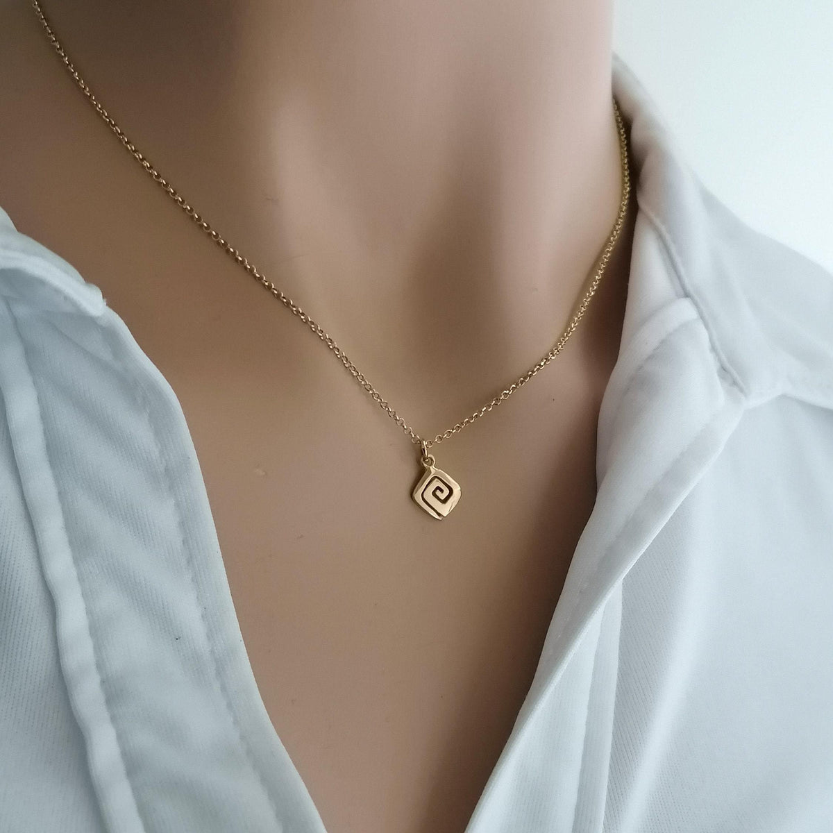 Spiral Necklace | Minimalist Small Sacred Geometry Pendant Sterling Silver | Cosmic Evolution Charm, close-up detail