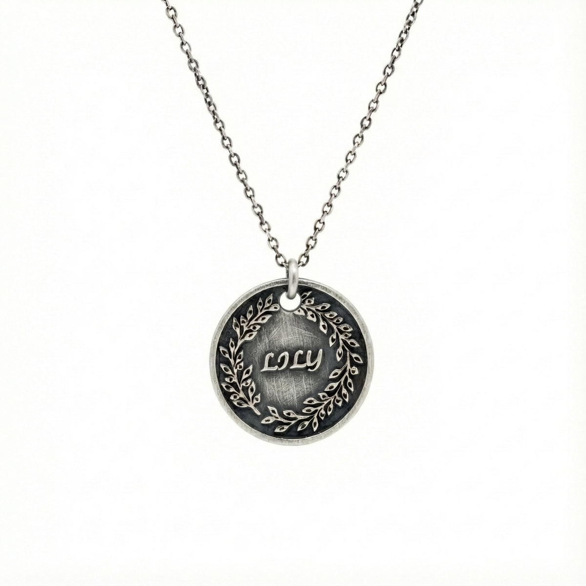 Custom Name Necklace Pendant | Hand-Stamped Sterling Silver Laurel Wreath Charm | Personal Victory Medallion, styled view